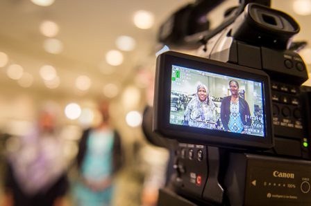 view of a camera recording two women speaking