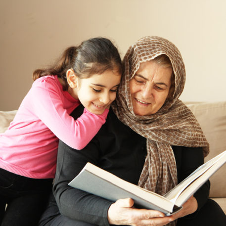 Grandmother and daughter read together