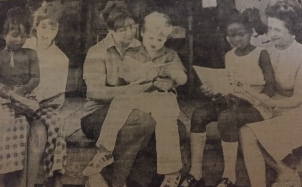 Old newspaper clipping showing one of the author's sitting in her old "school". 